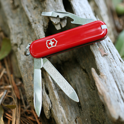 VICTORINOX<sup>&reg;</sup> Original Swiss Army™ Knife - Small pocket knife is packed full of tools.  Includes: blade, nail file and cleaner, bottle opener, screwdriver, wire stripper, key ring, tweezers and toothpick.  Made in Switzerland. 
